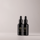 Gold Oud Beard Oil drops on hand — non-greasy beard oil for growth